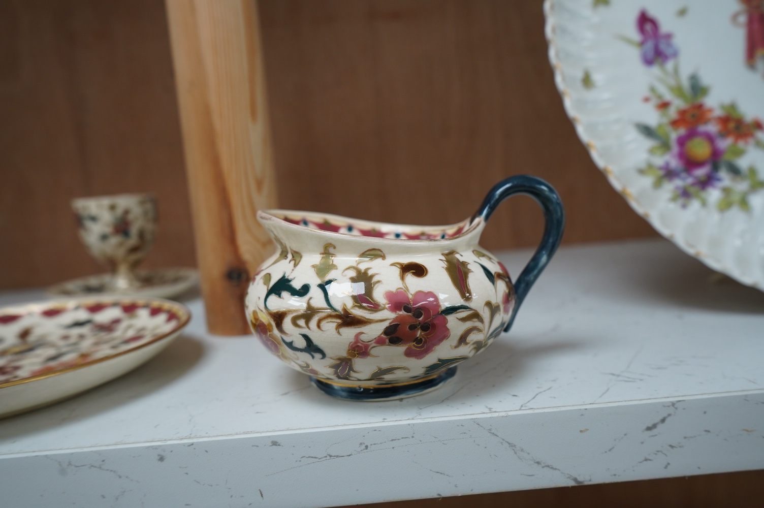 Four pieces of Zsolnay tableware in ‘Persian’ style, tallest 17cm. Condition - crazed but good